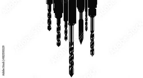 Collection of drill bits in silhouette against white