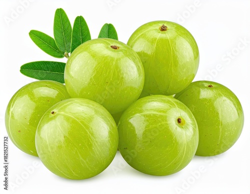 Fototapeta Naklejka Na Ścianę i Meble -  Pile of green amla fruits with delicate leafy sprig