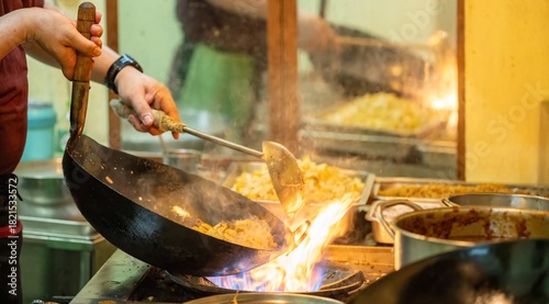 Photography Pad Thai noodles is fried noodles cook in pan with big fire flame is hong kong style