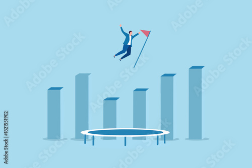 Businessman jumping from trampoline over bar graph to reach goal