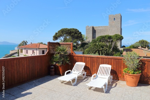 Rocca di Talamone - Talamone Castle in Tuscany, Italy, seen from a rooftop terrace.