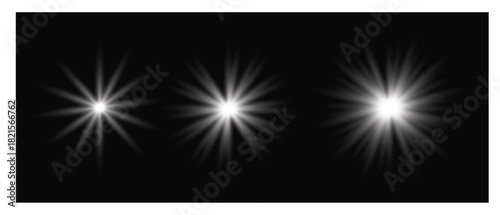 Three bright starburst light effects on a dark background.  Three distinct starburst light effects, varying in size and intensity, emanate from bright centers against a deep black background.
