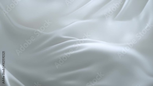 Abstract dynamic background of luxurious white silk or satin fabric flowing in soft, elegant waves.
