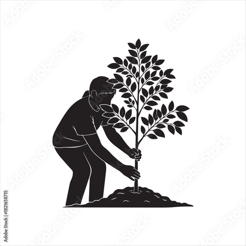 Man planting tree silhouette for environmental conservation