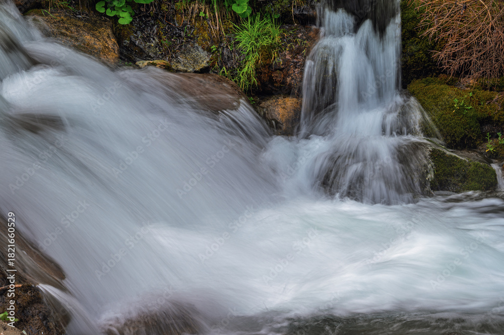 Fototapeta premium close-up of small waterfall along the creek San Nicolò inside San Nicolò valley, Val di Fassa, Dolomites, Italy