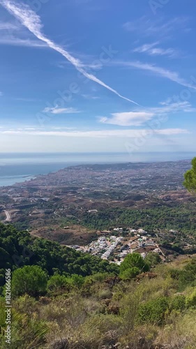 Panoramic view unfolds from the scenic hiking path leading to Mijas peak, showcasing the stunning landscapes of Andalusia, Malaga, Spain