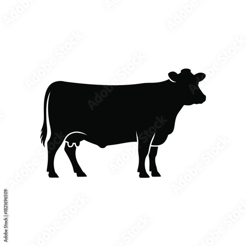 Black silhouette of a standing cow on a white background