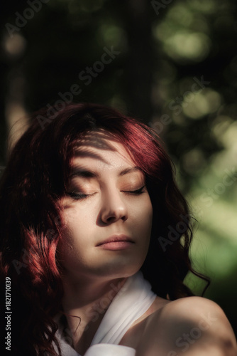 Wallpaper Mural Portrait of red-haired girl with beautiful plant shadow on face Torontodigital.ca