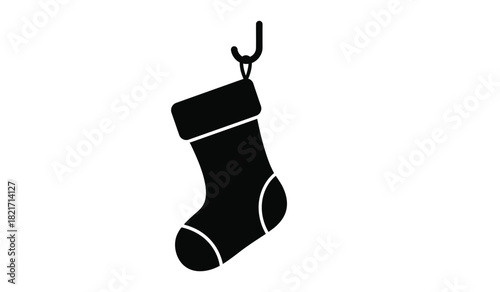 Black silhouette of a christmas stocking hanging on a hook for decoration