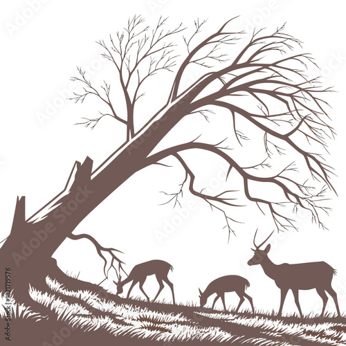 Silhouettes of deer grazing in a grassy field under a large bare tree with intricate branches