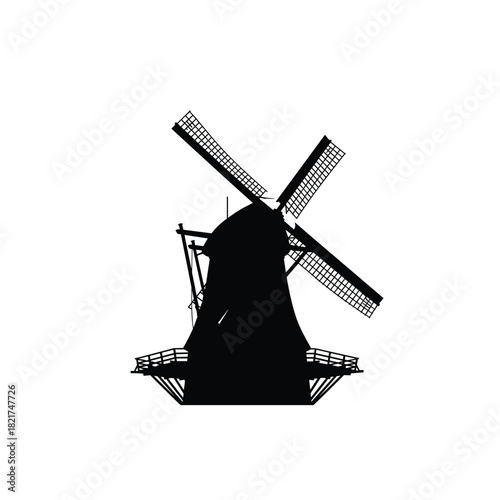 Silhouette of a traditional dutch windmill with rotating blades against a white background