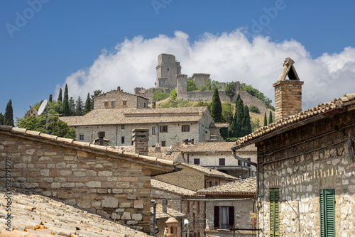 View of Rocca Maggiore castle, ruins of medieval fortress located on hill above city, Assisi, Italy