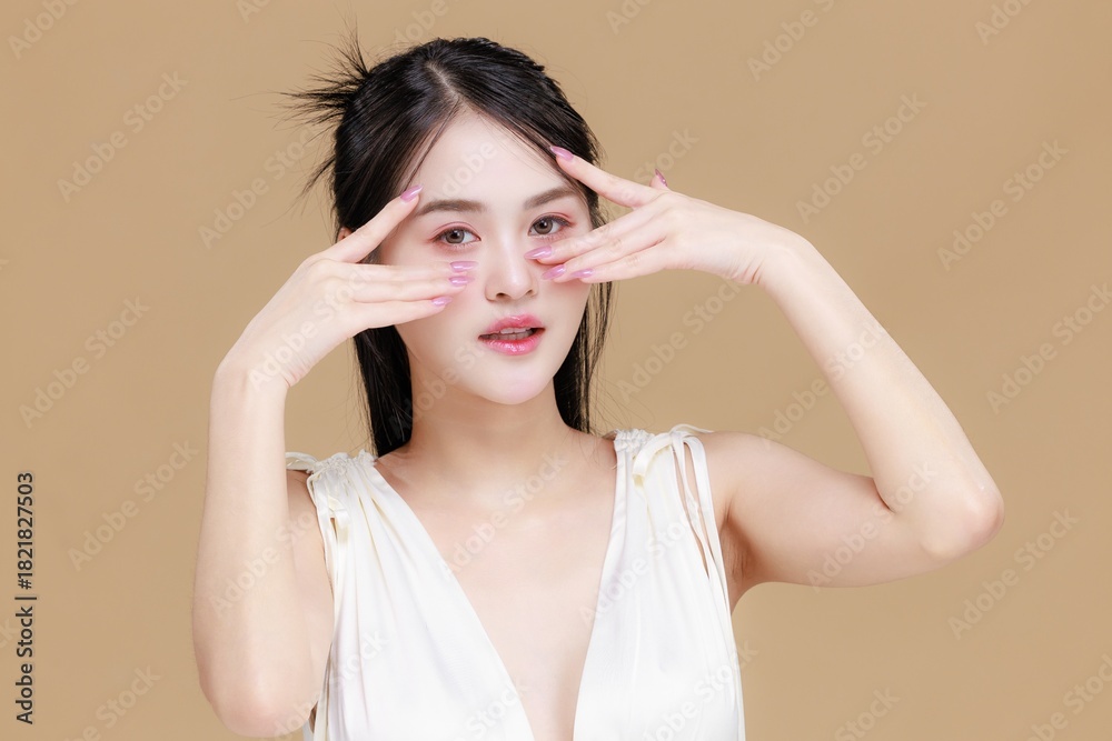 Fototapeta premium Beautiful Young Asian Woman Portrait. Natural Makeup and Clean Fresh Skin Concept for Beauty, Spa, and Skincare.