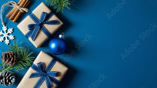 Festive christmas gifts and decorations on a deep blue background