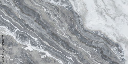 Blue ocean wave texture on the beach sand with white sea foam and wet rocks