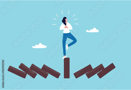 Mindfulness meditation relax to reduce stress and eliminate distraction, calm to build energy or spiritual wellness concept, success woman relax and meditating with yoga pose on standing domino