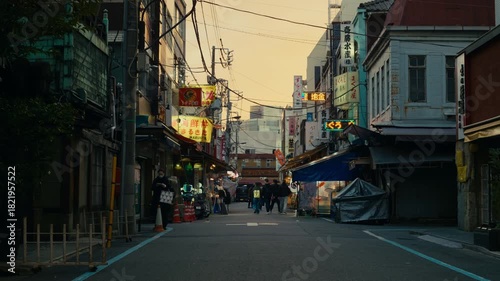 Blue hour mood on a Tokyo roadway with illuminated signs and urban detail.
