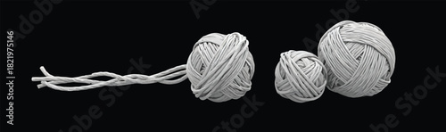 Three yarn balls connected by strands on a black background