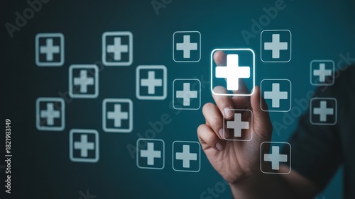 Human finger interacts with glowing medical plus sign icons on a digital interface