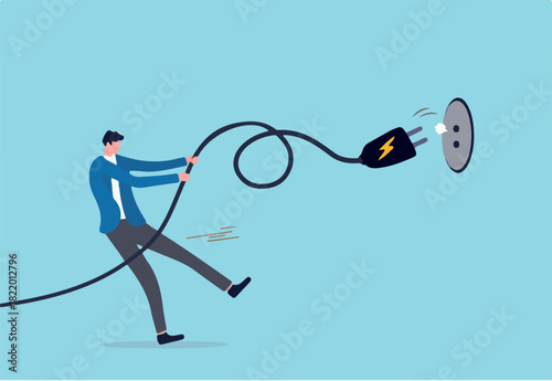 Electricity saving, ecology awareness or reduce electric cost and expense concept, man pulling electric cord to unplug to save money or for ecology power.