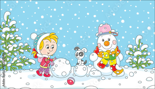 Happy little girl with a puppy making a funny snowman with a striped scarf and a bucket on its friendly smiling head on a beautiful snowy day in a winter park, vector cartoon illustration