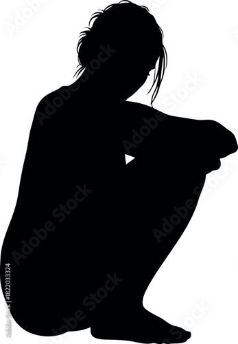 Woman silhouette crouching contemplative pose