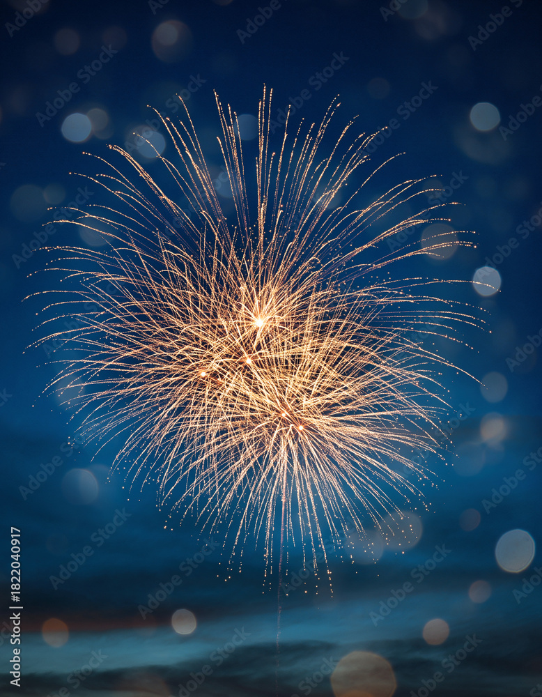Fototapeta premium Golden Fireworks and Blue Bokeh Lights on Dark Festive Background