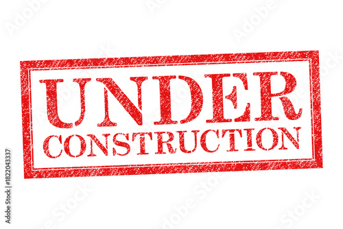 Vector red rubber stamp text Under Construction isolated on the white background.