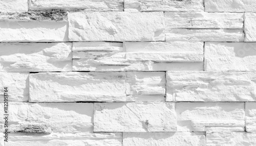 A detailed closeup of a stone wall with a grey bedrock pattern. Natural pattern brick stone wall for wallpaper background.
