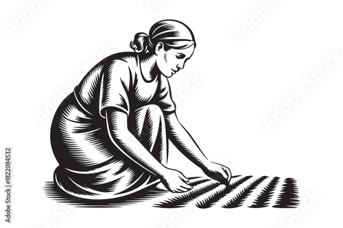 Woman working in a field with rows of plants