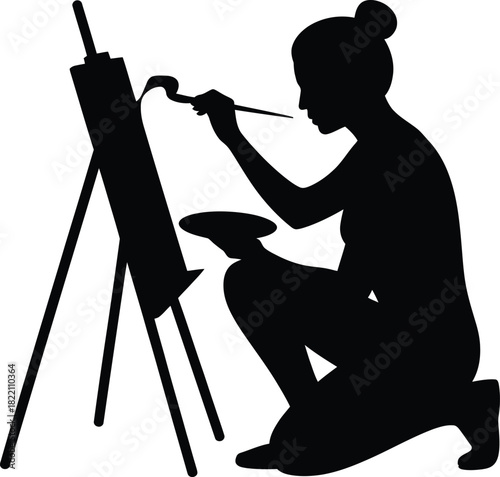 Artistic silhouette of a person engaged in the act of painting a creative work with vibrant colors and expressive brushstrokes