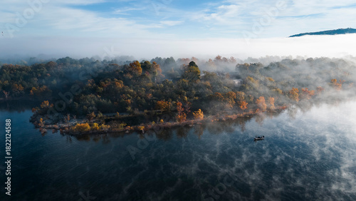 Fishermen fishing on a foggy fall morning on table rock lake