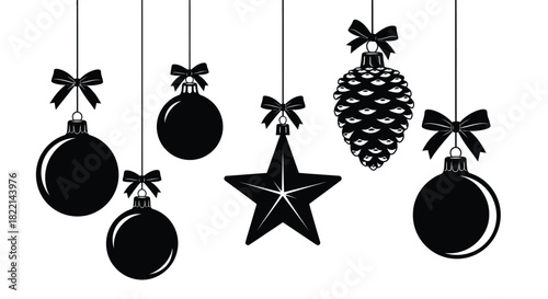 Several black Christmas ornaments and a pine cone are hanging by ribbons against a white background.