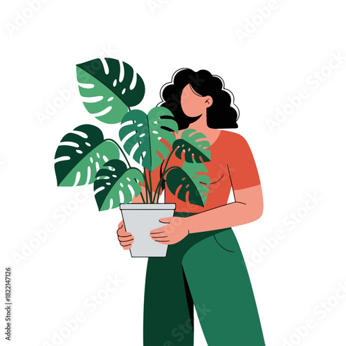 Woman holding Monstera plant, showcasing its vibrant foliage and creating serene atmosphere, this Monstera plant is perfect. Lush Monstera plant,