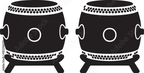 Black silhouette of two taiko drums stand side by side in a vector