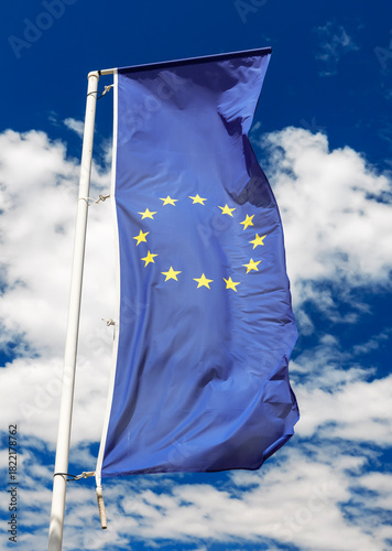 Waving european union flag at blue sky