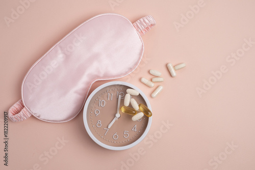 Sleep mask, alarm clock, and supplements for restorative health. Scheduled wellness.