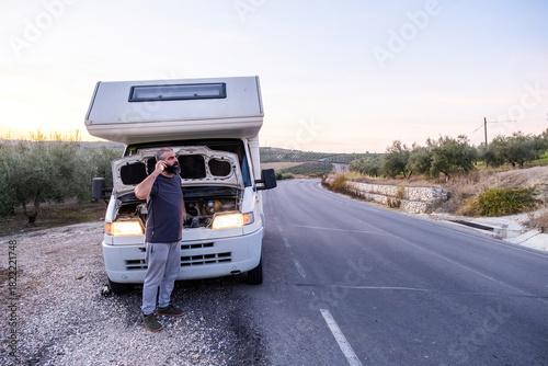 Photos Man calling for roadside assistance after rv breakdown