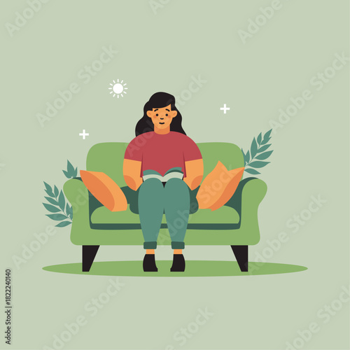 young woman sitting on a chair and reading a book