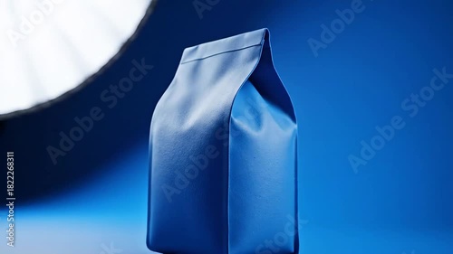 Minimalist Blue Packaging with Dramatic Shadow and Light.