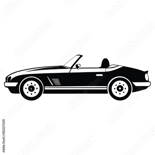 Classic black and white convertible car presents a vintage silhouette in profile view