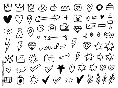 A collection of hand drawn doodle elements including crowns hearts and cameras