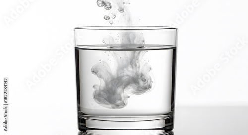 Supplement Beauty ,Collagen, Dissolving Cloud Smoke or Ink Plumes into Glass of Water on Whit