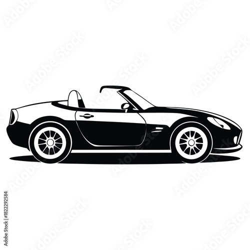 Striking monochrome side profile portrays the sleek silhouette of an open top modern roadster