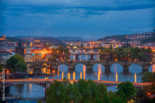 Scenic night view of Prague bridges at twilight. Manes, Charles, Legion, Jirasek and Palacky bridges across the Vltava river. Downtown of Prague city, Czech Republic
