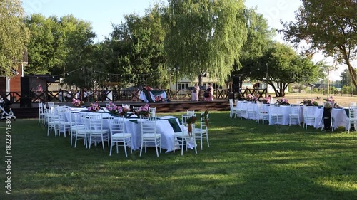 White wedding table outside with floral decorations