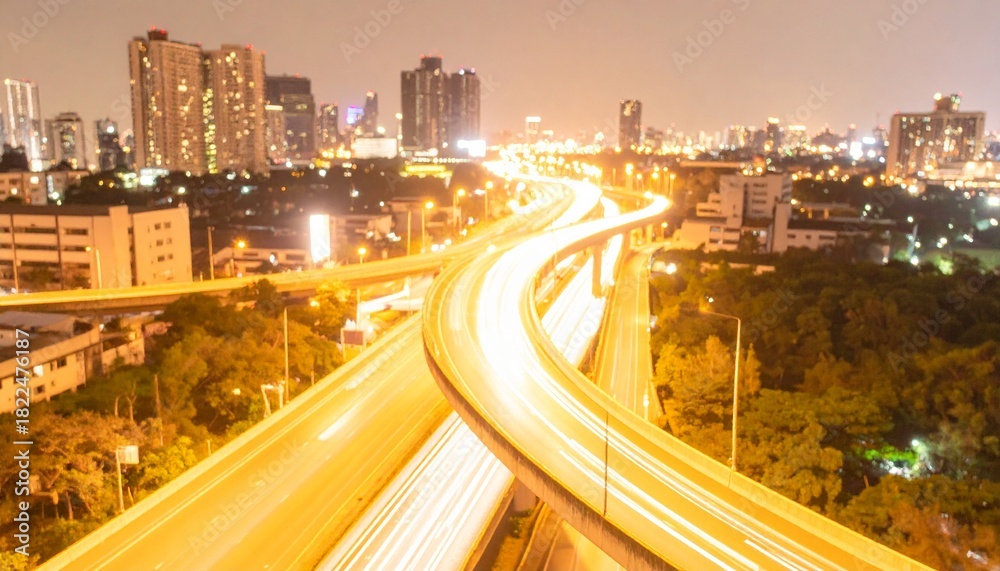 Obraz premium Aerial Blurry City Highway at Night with Light Trails in Winter