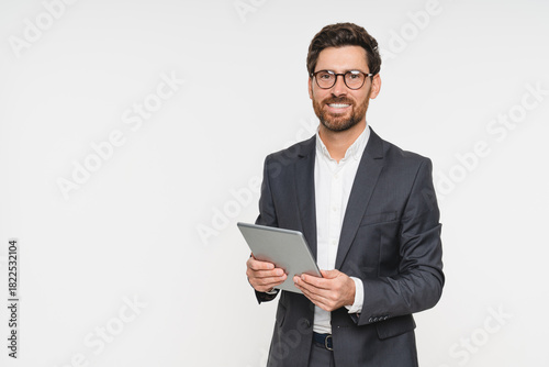 Portrait, smile and business man with tablet in studio isolated on white background. Ceo face, professional boss and happy Caucasian male entrepreneur with touchscreen technology.