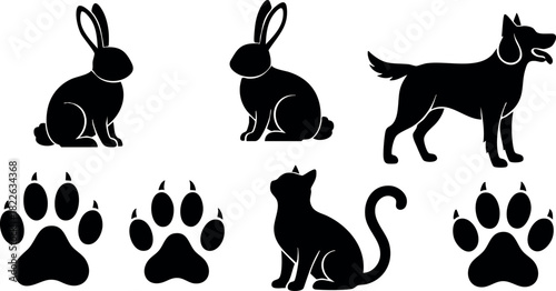 Black silhouette icons of rabbit dog cat and paw prints vector