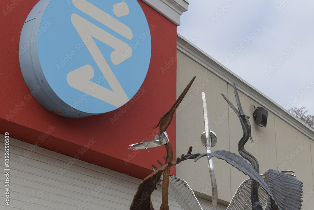 Obraz premium Shoppers Drug Mart logo sign outside location at 550 Eglinton Av W (with detail of Gathering by Mark Puigmarti), Toronto